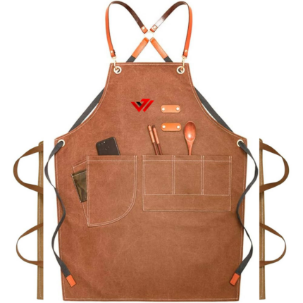 Heavy-duty brown waxed canvas work apron with leather cross-back straps, brass hardware, and custom logo by JACX Wears