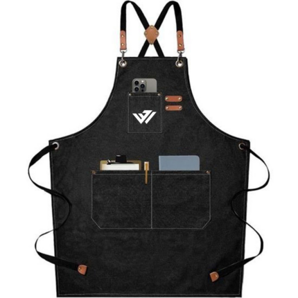 Heavy-duty black canvas work apron with leather cross-back straps, brass hardware, and custom logo by JACX Wears